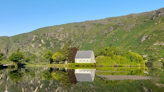 Chapel reflected in lake on a Wild Atlantic Way tour of Ireland