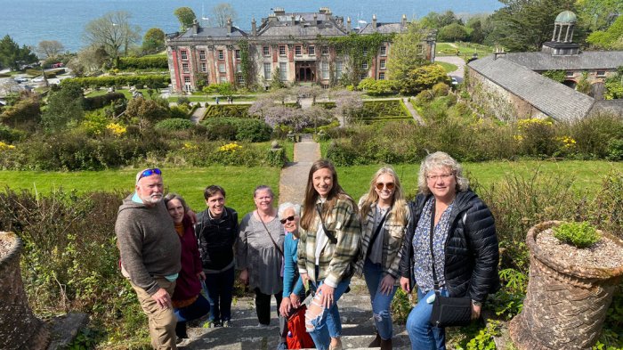 Tour guests in front of historic house on Wild Atlantic Way tour of Ireland