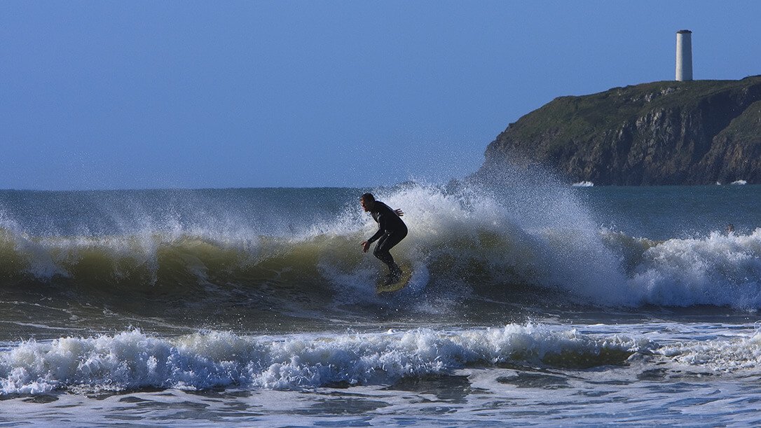 Surfer on wave in Ireland