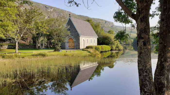 Chapel on a reflective lake in Ireland