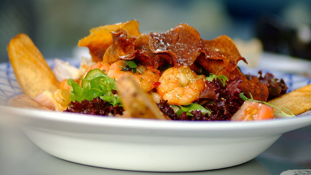 A bowl of seafood including praws and salad from a restaurant in Kinsale