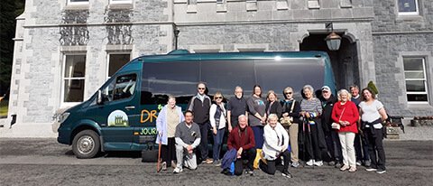 11 day tour group with their vehicle and hotel in Ireland