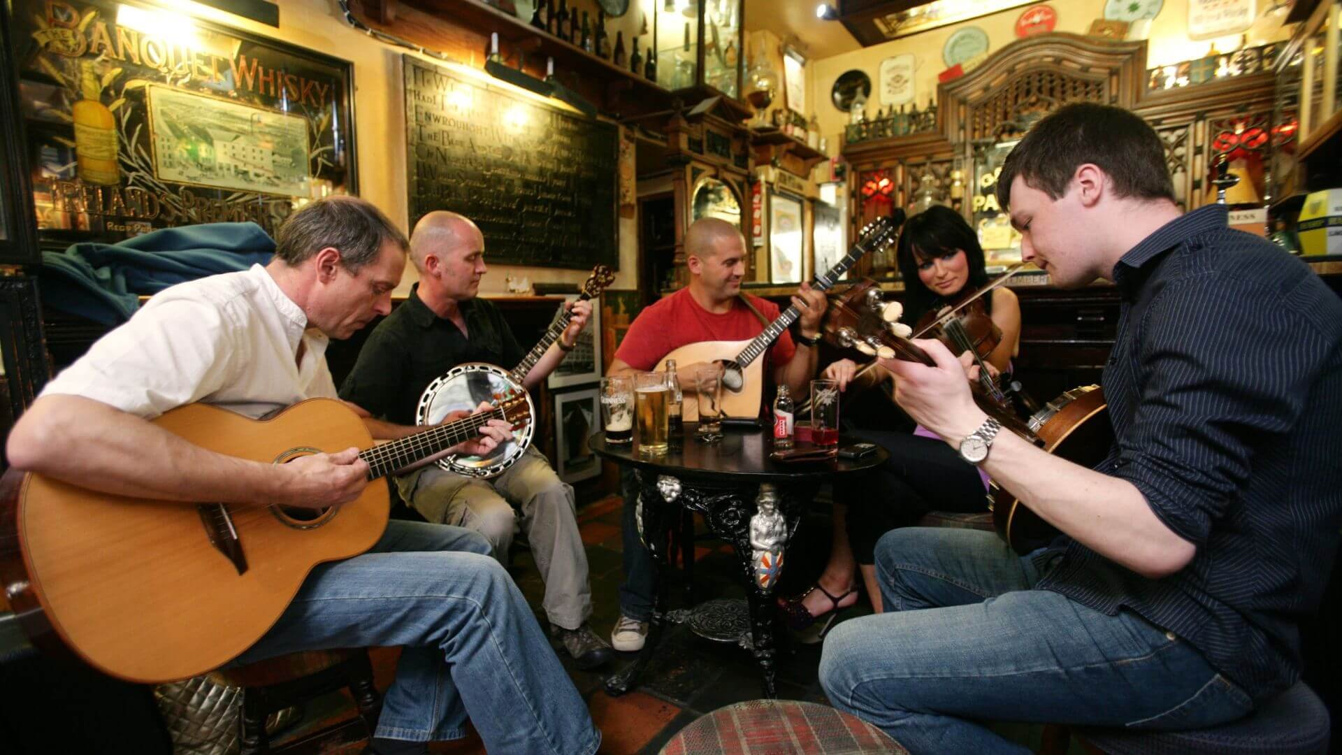 a group of musicians playing in a pub