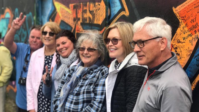 A tour group at the peace wall in Belfast, Northern Ireland