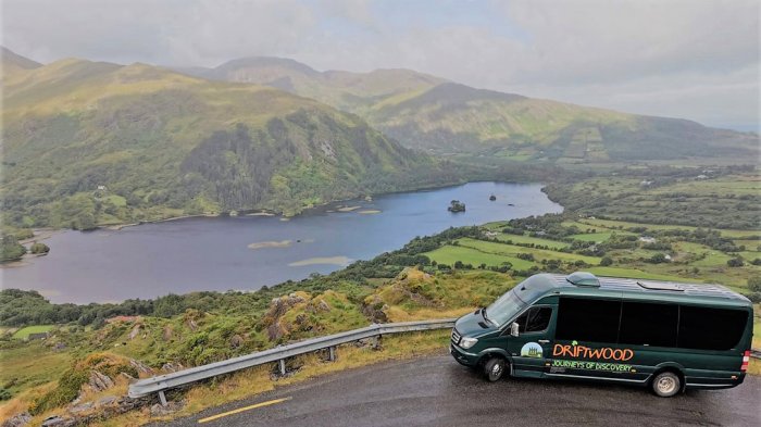 A Driftwood tour vehicle parked at a scenic spot on the Healy Pass in Ireland