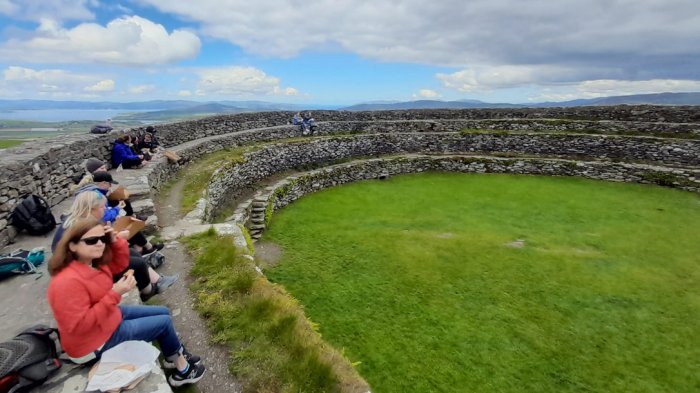 Tour group at stone ring fort while touring Ireland for 2 weeks