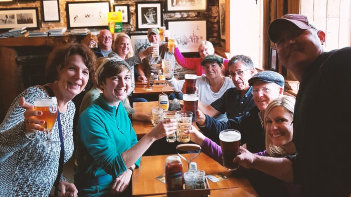 Tour group toasting 2 weeks in Ireland in a pub
