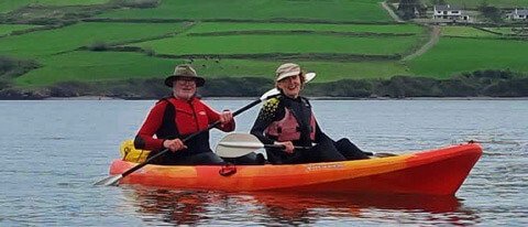 2 tour guests kayaking in Ireland