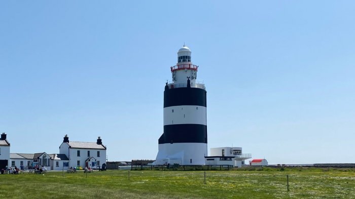 Hook Lighthouse with blue sky behind in Ireland
