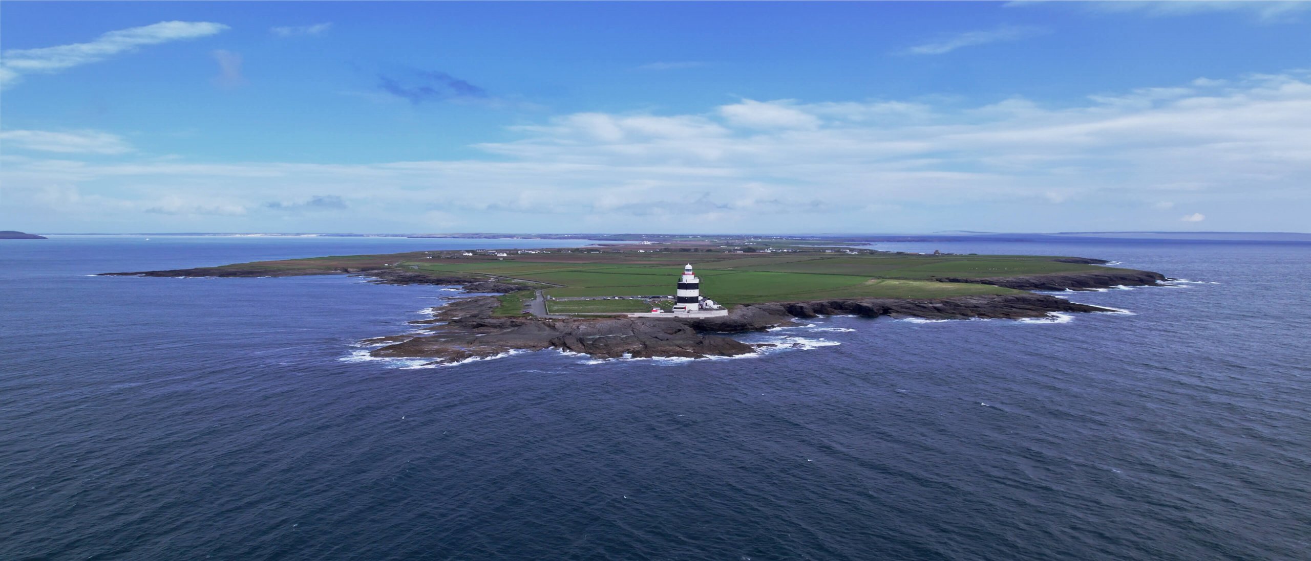 a drone shot of hook lighthouse on the hook peninsula
