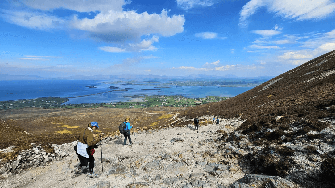 A group hiking on croagh patrick overlooking clew bay