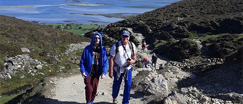 Two guests hiking on a 7 day Northern Ireland tour