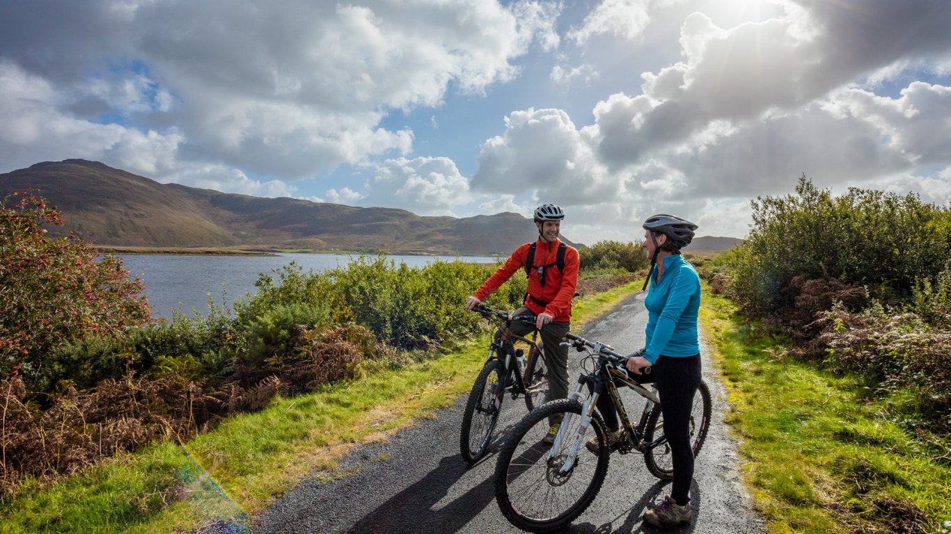 A couple on bikes on the Great Western Greenway in Mayo, Ireland