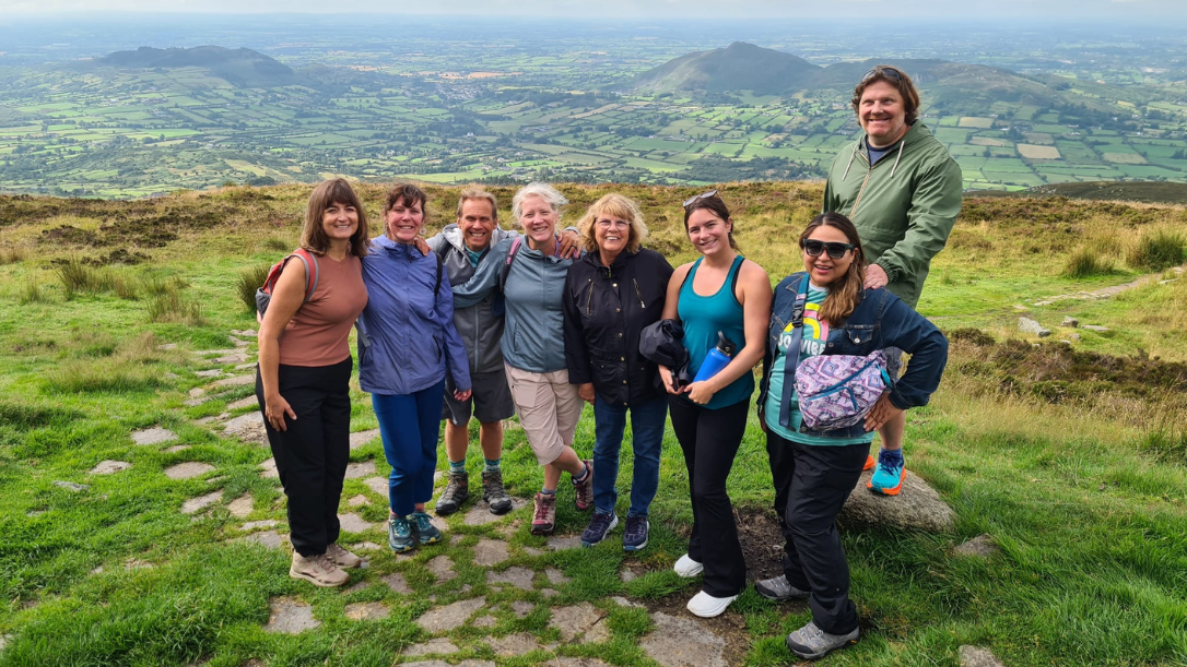 A group of guests on tour at the top of Slieve Gullion