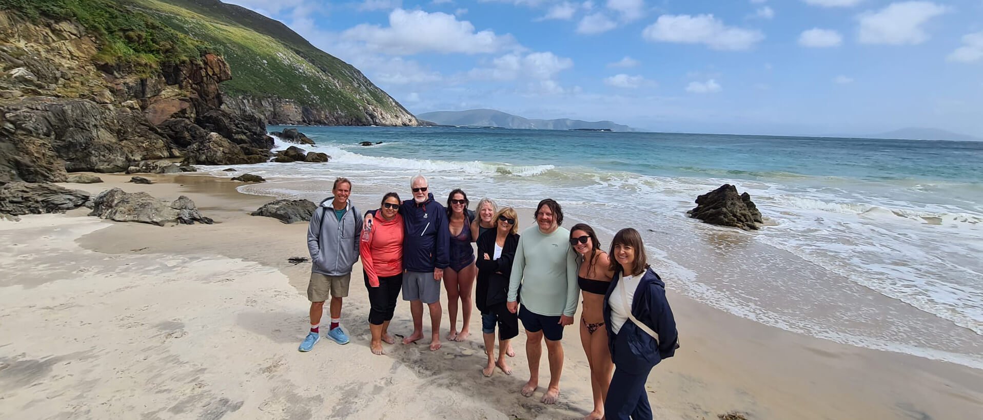 Tour group on a scenic beach on Achill Island, Ireland