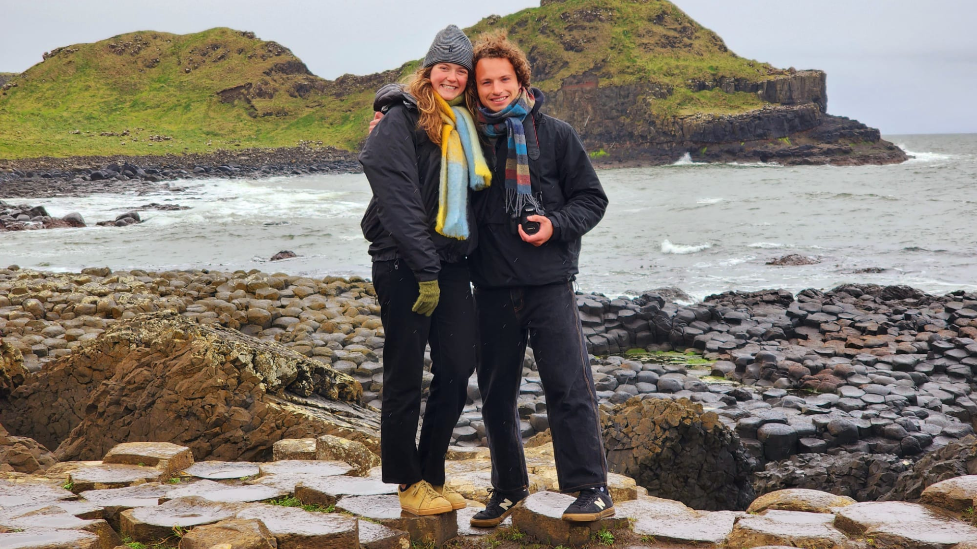 A mother and daughter getting a photo on the giant's causeway