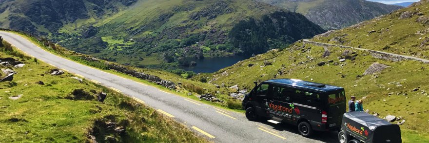A VagaTron 4x4 tour vehicle parked at a scenic location on the Healy Pass in Ireland 
