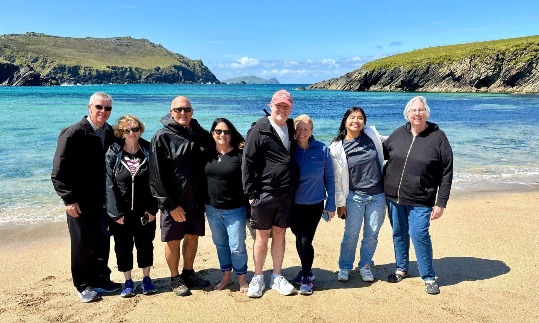 A group of guests standing on the beach on clogher strand