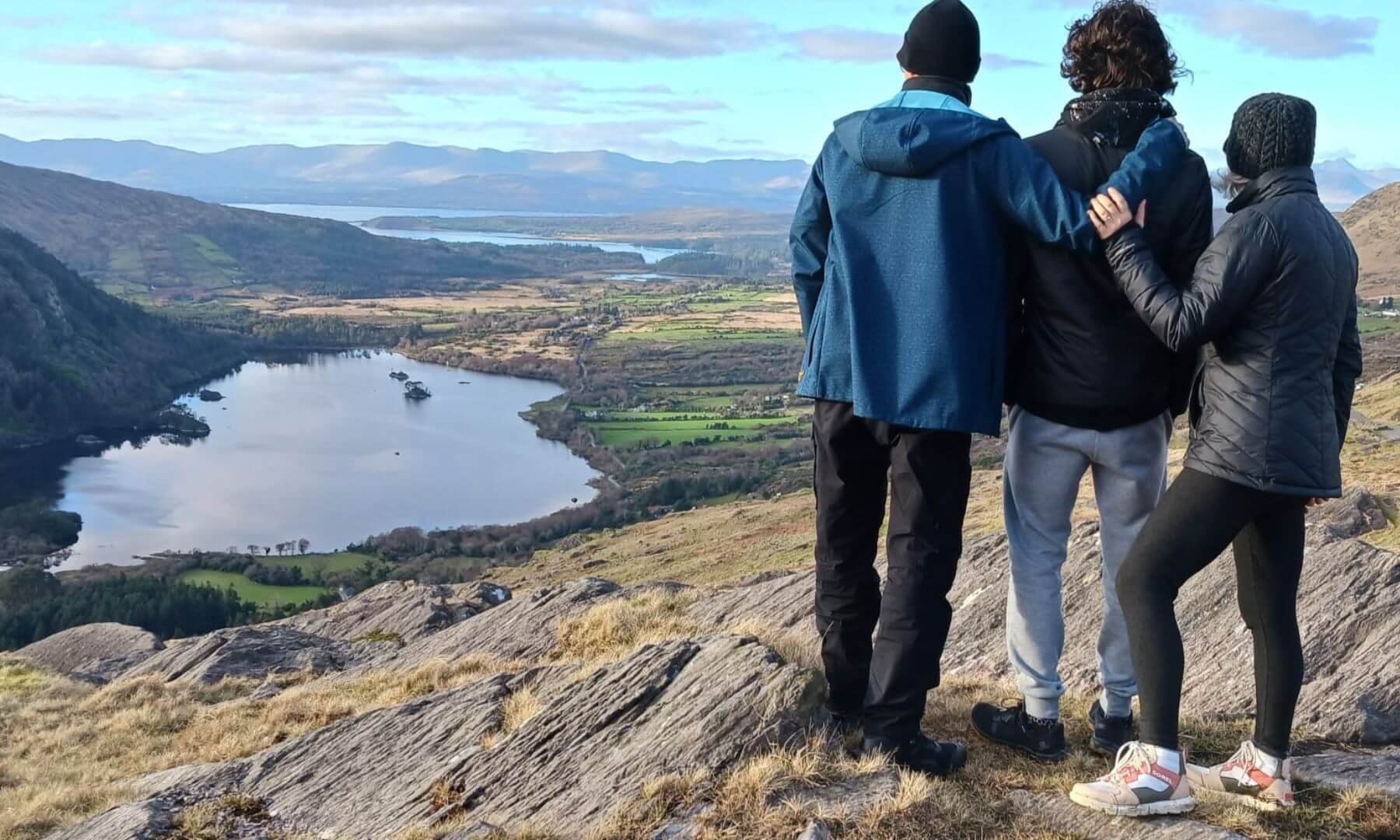 3 guests looking out at glanmore lake