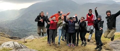 Energetic group jumping on an 8 day adventure tour of Ireland