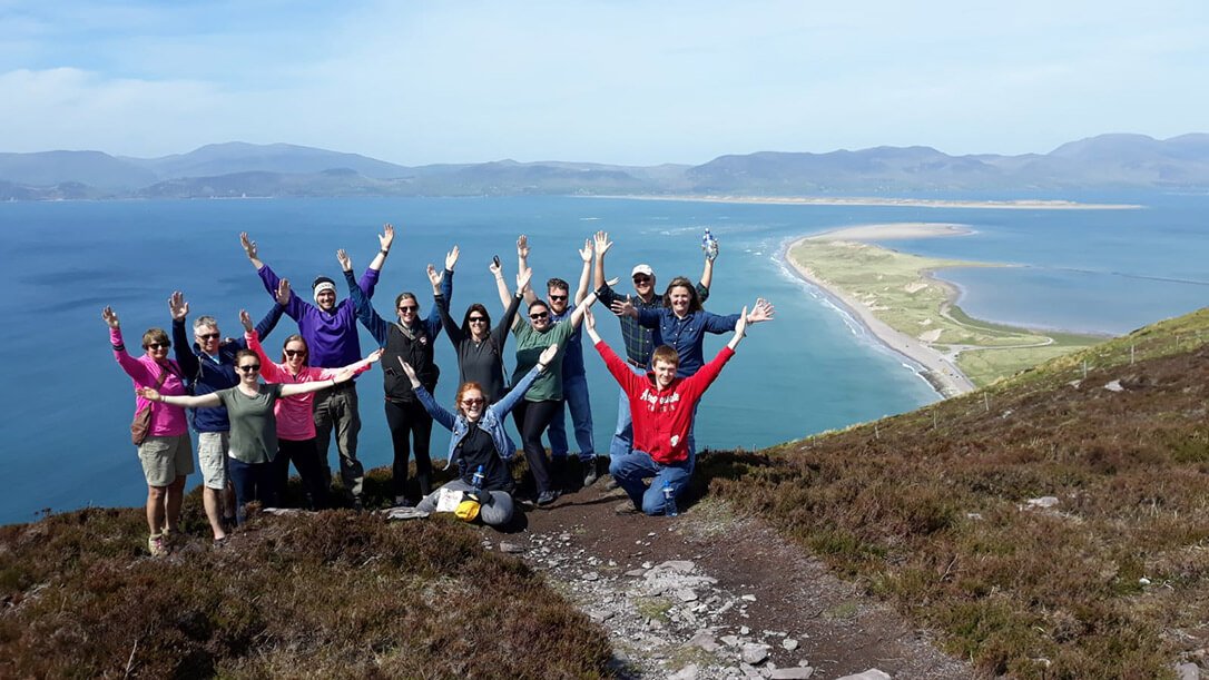 Vagabond guests on top of a viewing point overlooking Rossbeigh Beach