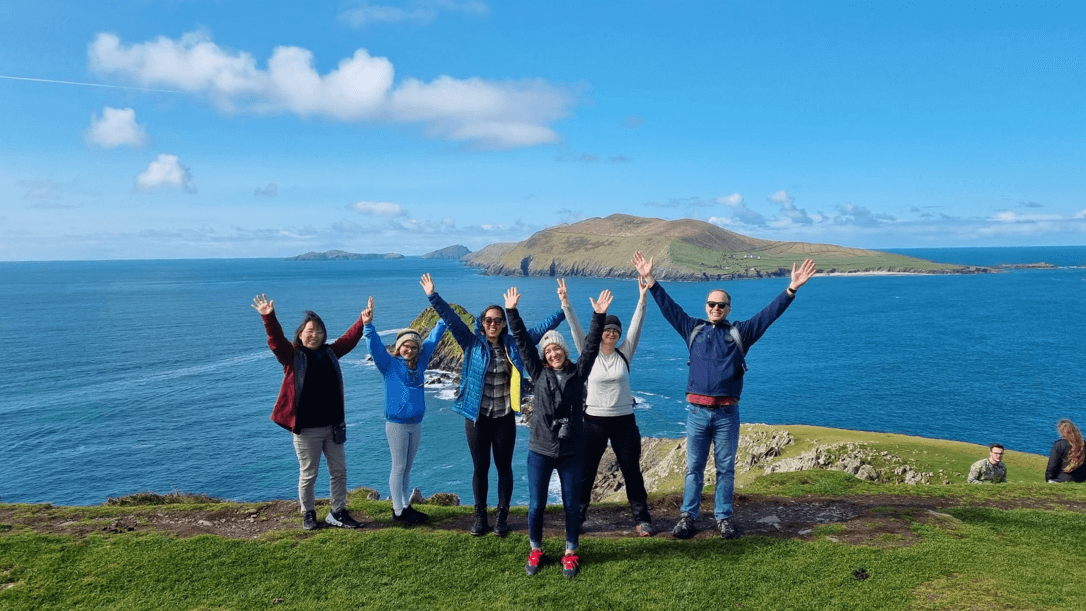 A group pf guests having fun with their hands in the air 