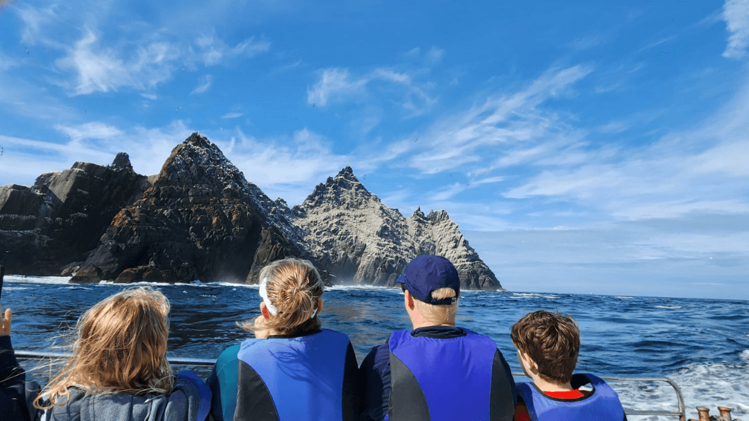 A family visiting skellig island on a boat 