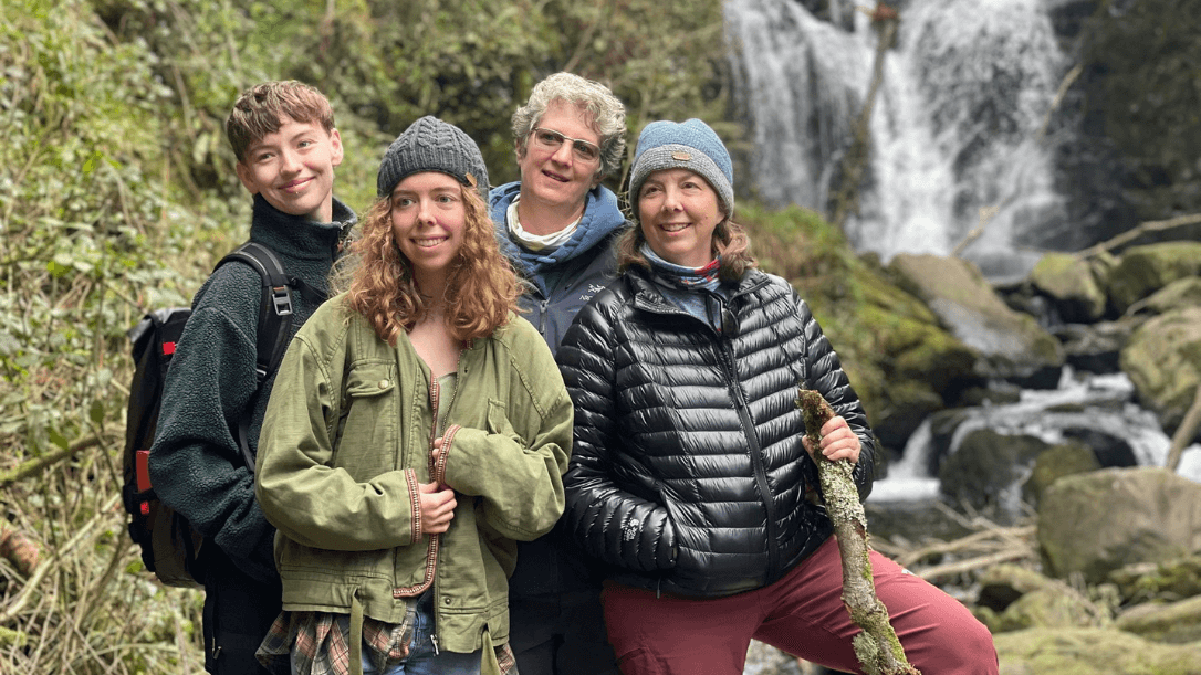 A family in front of torc waterfall in Killarney National Park