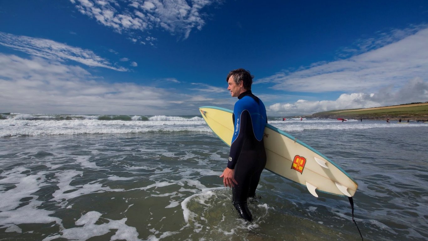 A male surfer in the sea in Ireland