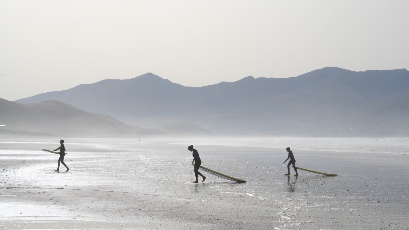 Surfers on a beach in Ireland