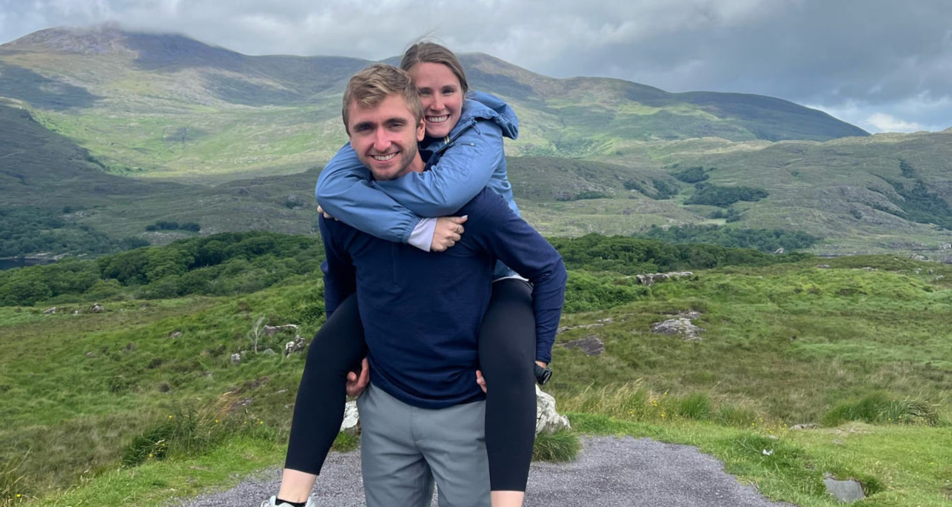 couple hugging and smiling on their romantic ireland vactaion