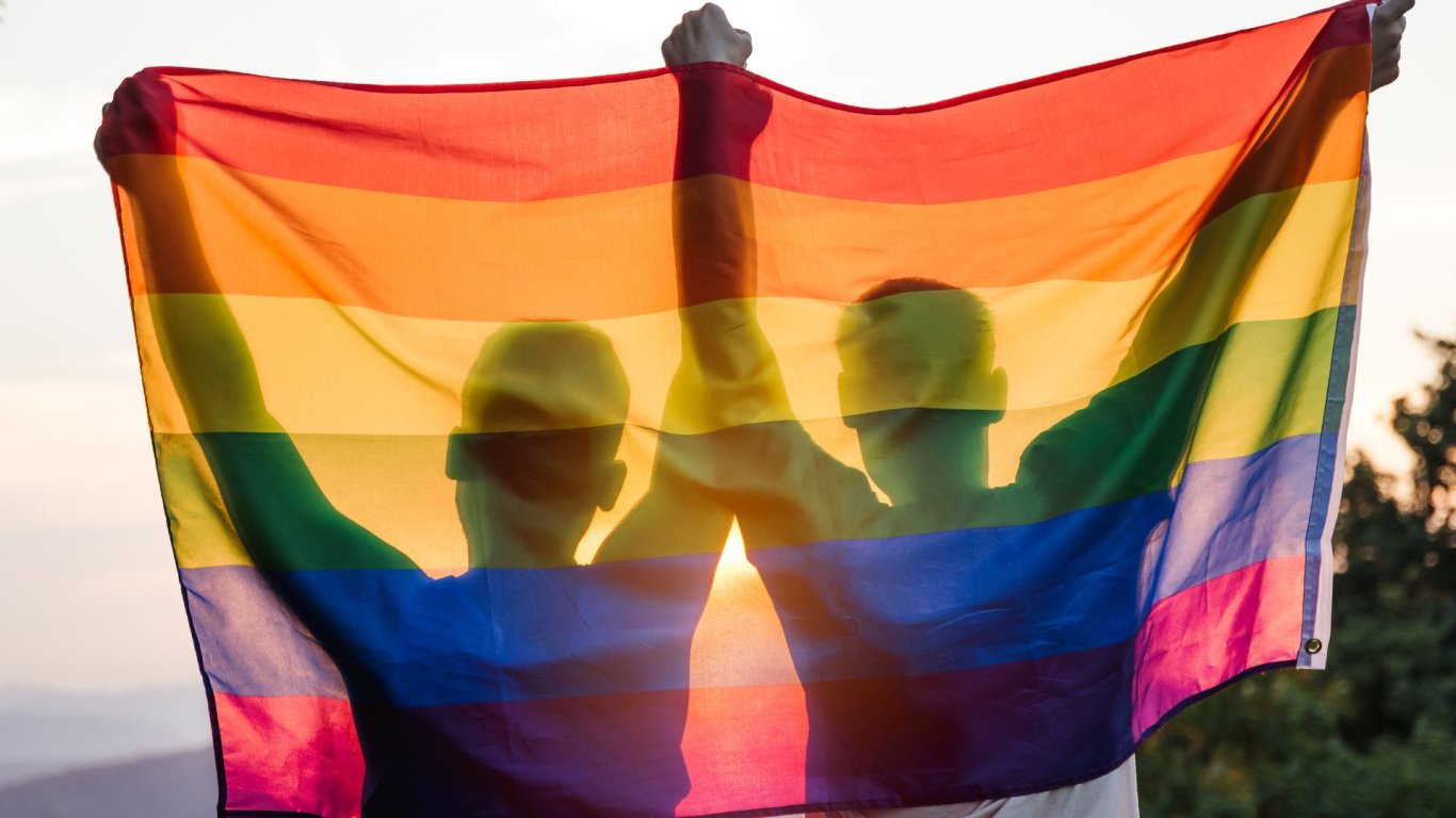 gay couple in ireland, holding pride flag