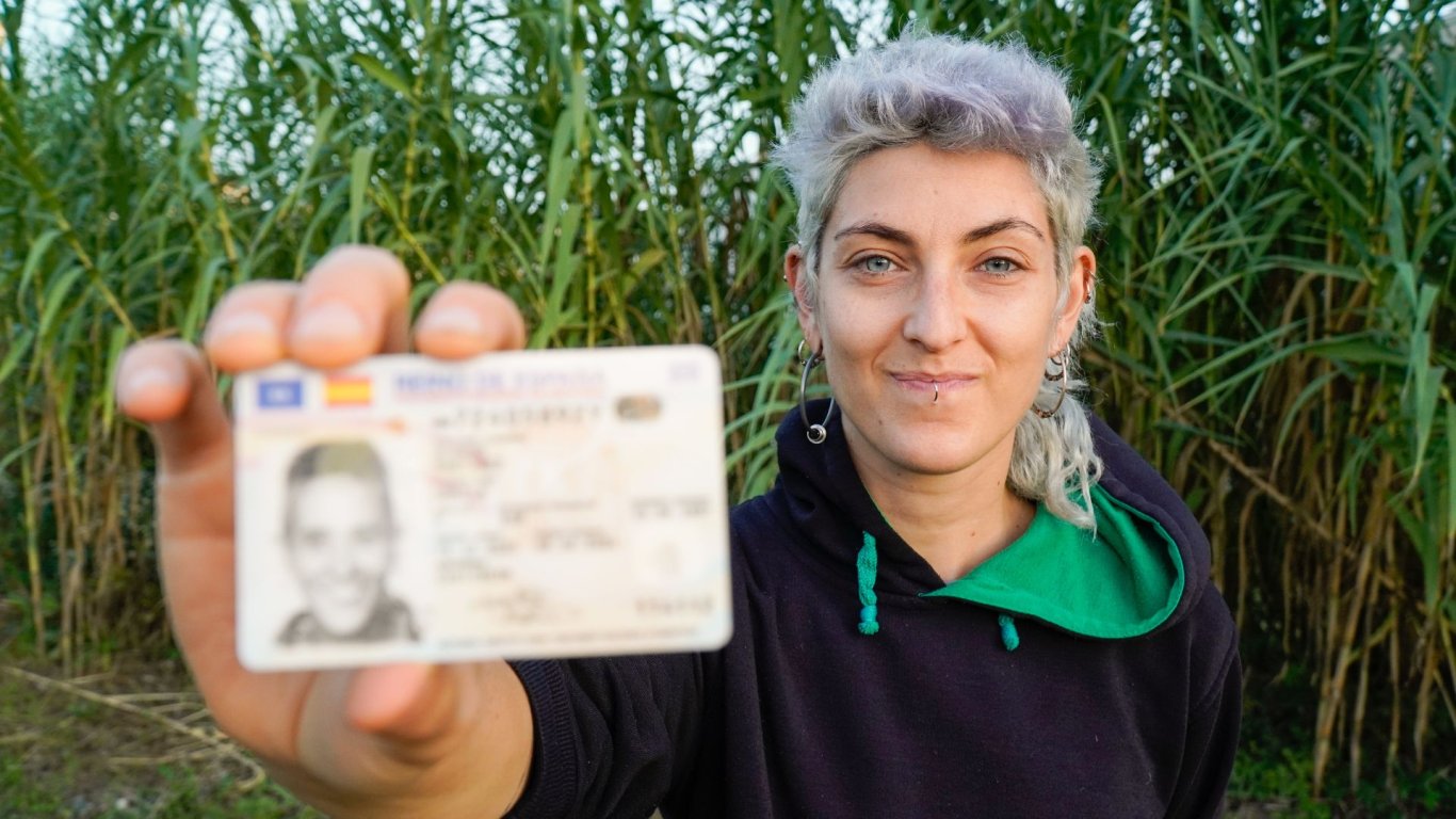 trans rights in ireland - non binary person holding passport