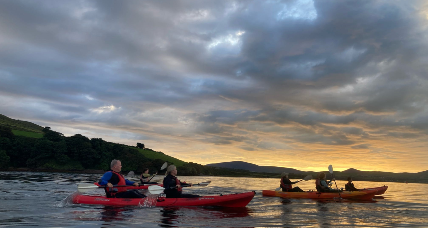 romantic kayaking in ireland at sunset