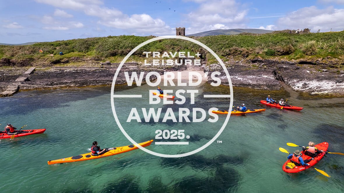 travel and leisure 2025 logo with kayaking in Dingle bay in the background