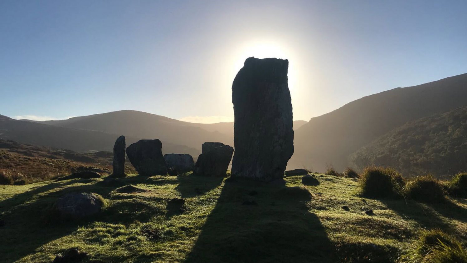 Uragh Stone circle silhouetted against the sun
