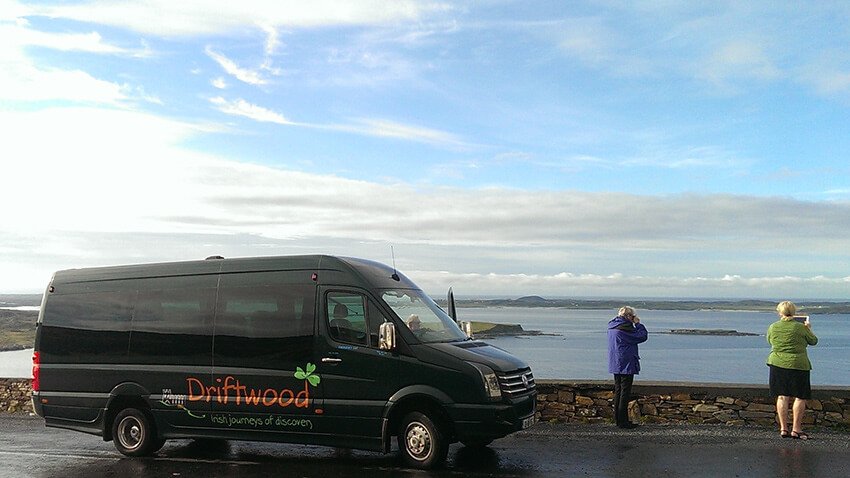 A Drifter tour vehicle with passengers admiring the blue sky overhead