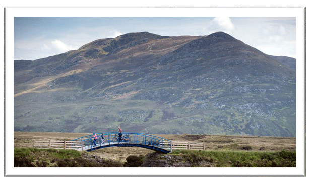 Cycling along the Greenway with the Nephin mountain range in the background