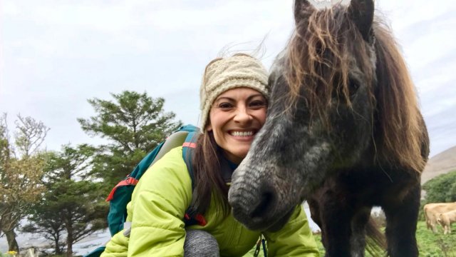 Vagabond guest poses for a selfie with a pony