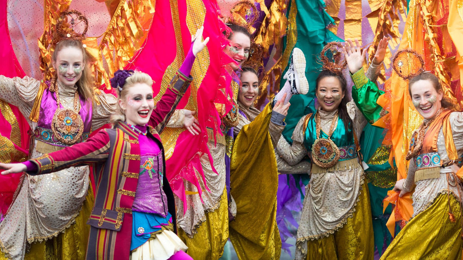 A group of colourful St Patrick's Day parade perfomers